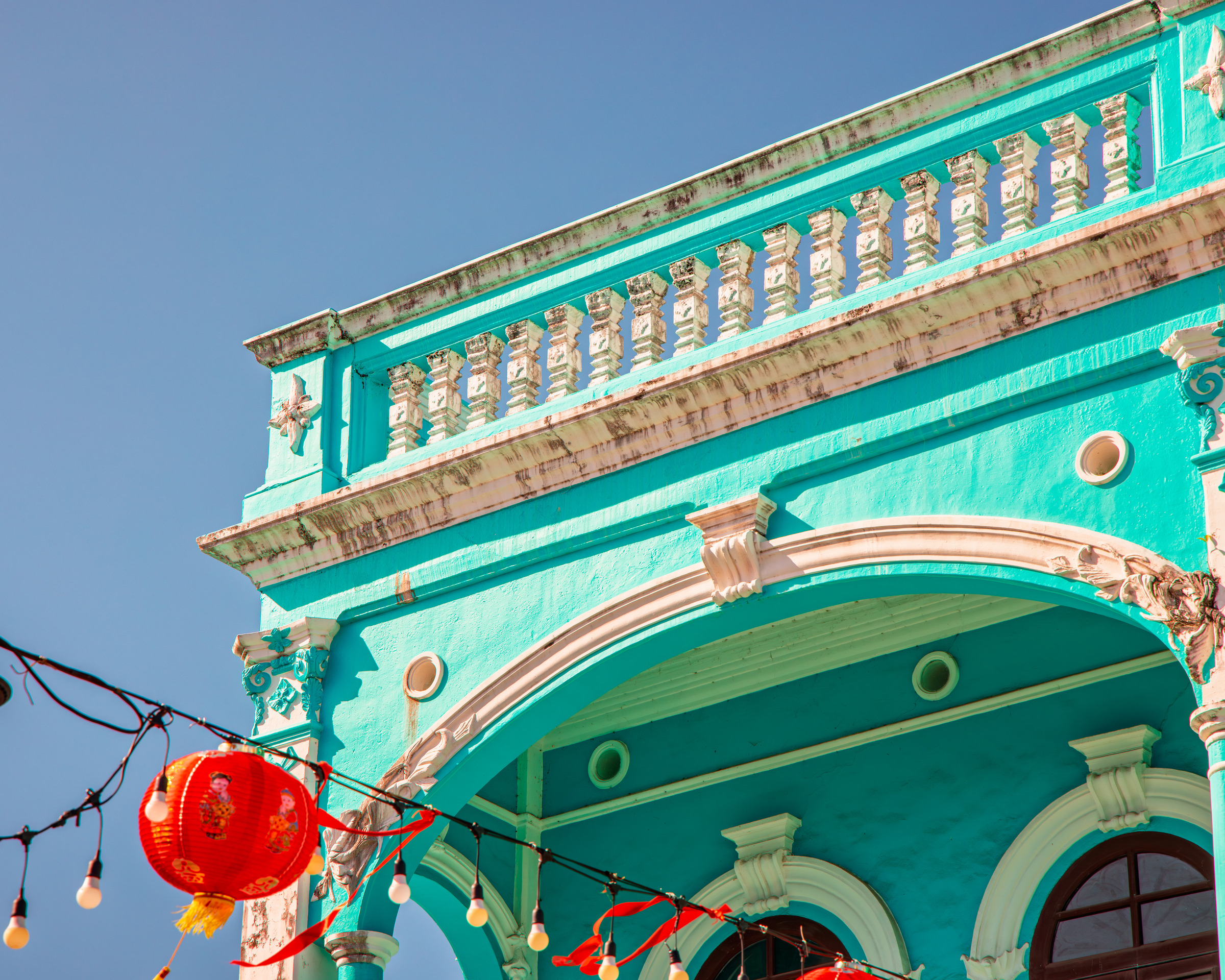 Turquoise architectural detail with ornate balustrade and arches, Sino-Portuguese style — architectural photography
